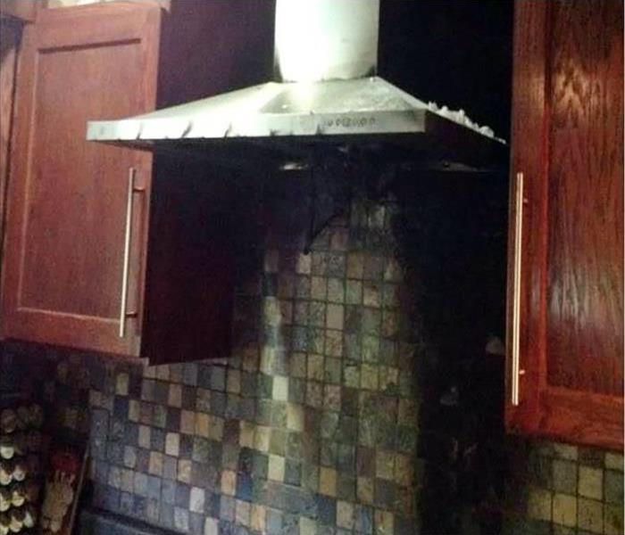Fire damage in a kitchen above the stove