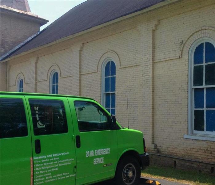 SERVPRO van parked in front of a Columbia, TN church struck by storm damage