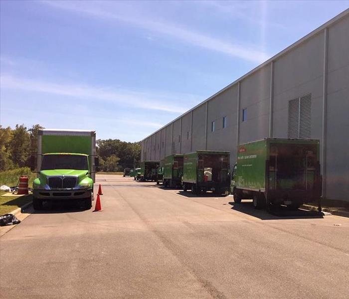 SERVPRO trucks parked behind a Maury County business